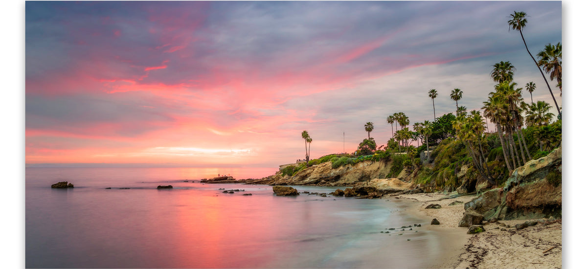 Wide Laguna Beach coastal photograph shown above a sofa for sizing illustration
