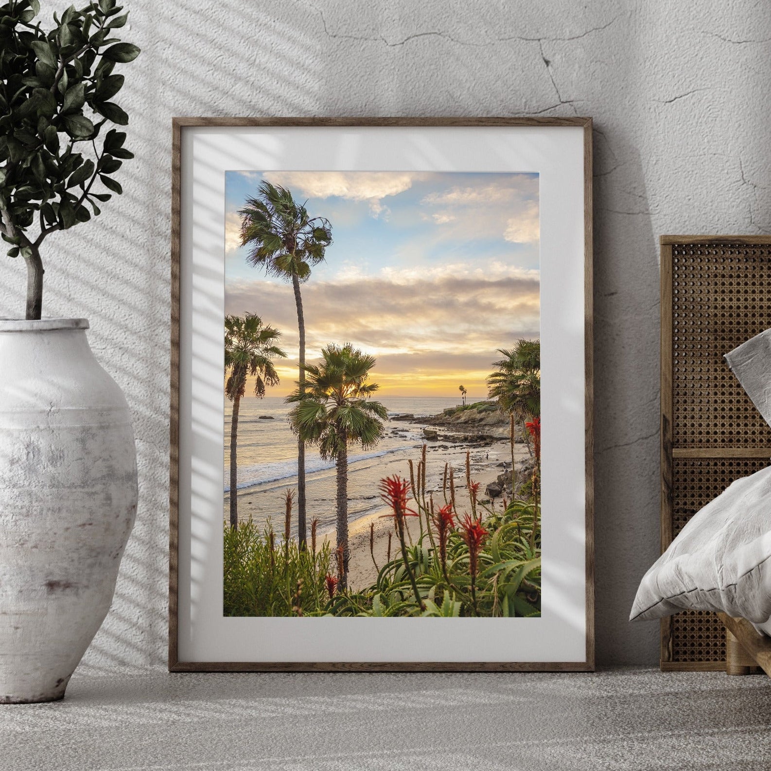 Laguna Beach coastal fine art photography displayed in a neutral bedroom interior