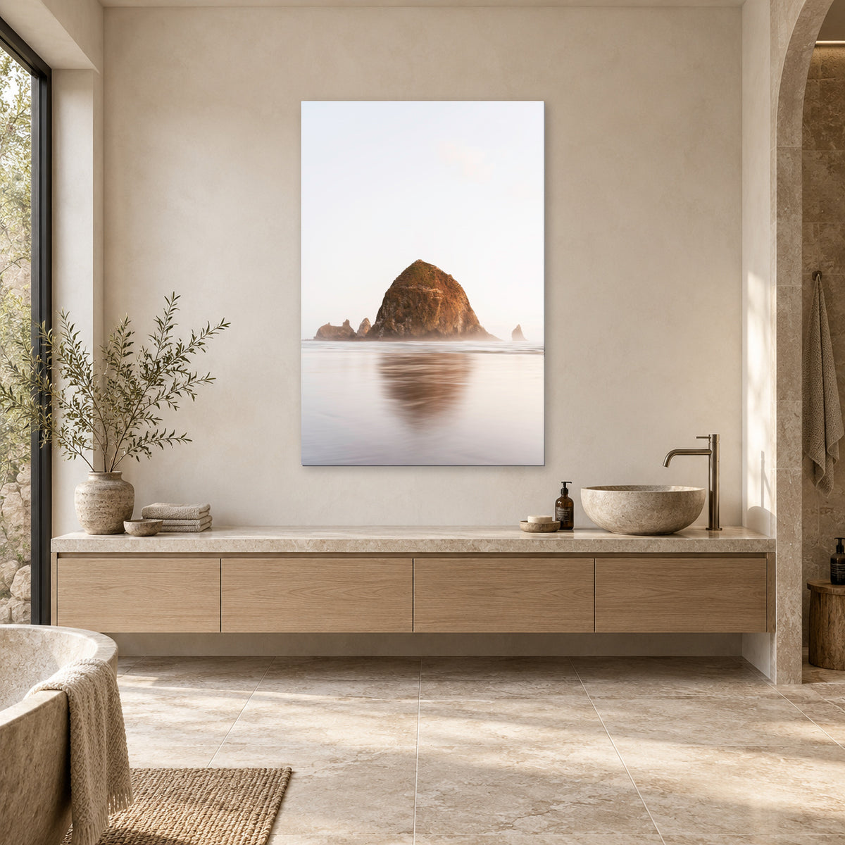Haystack Rock print from Cannon Beach, Oregon displayed in a spa bathroom, without a frame; room mockup.